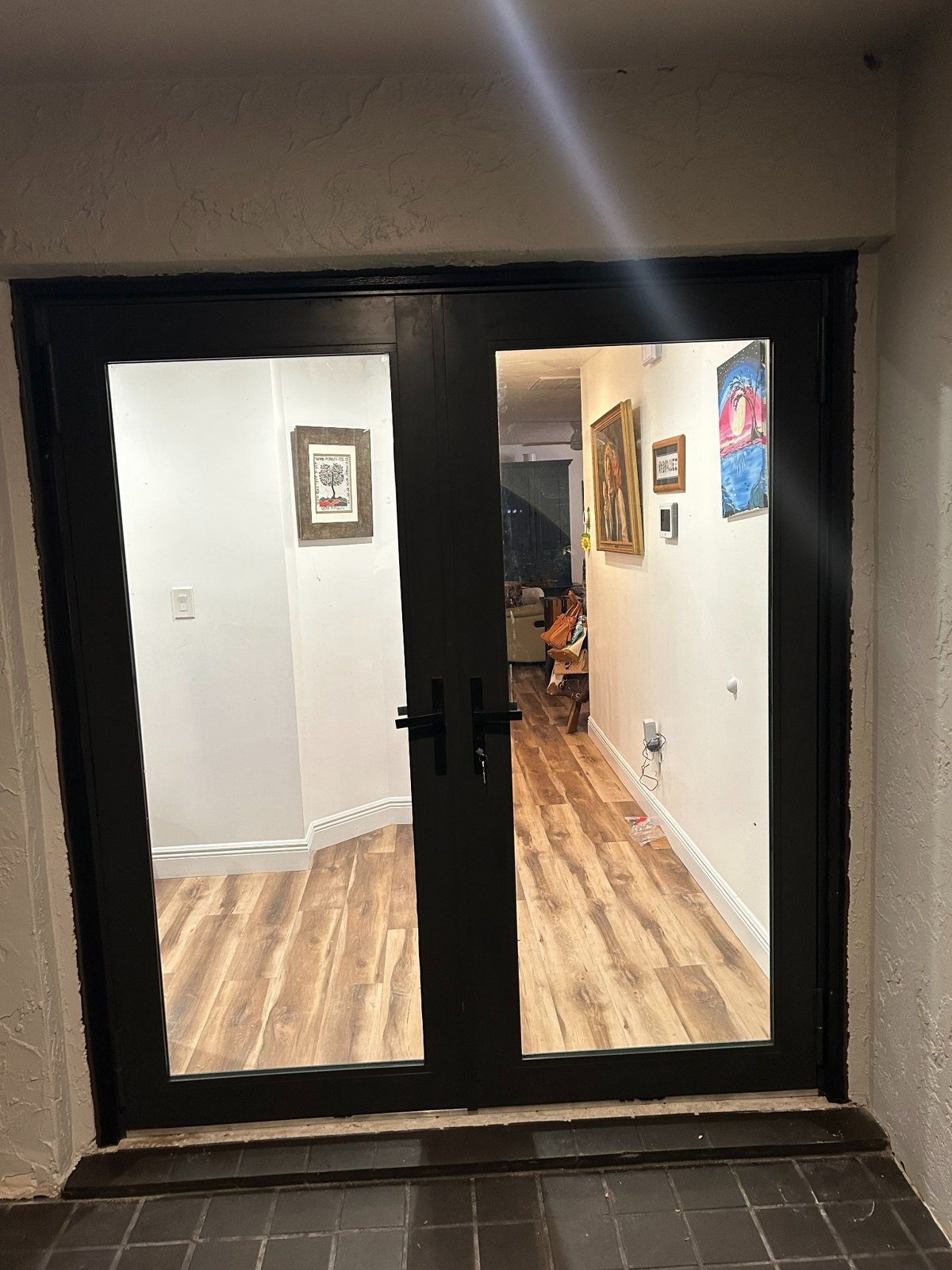 Exterior view after impact-rated double entry door replacement