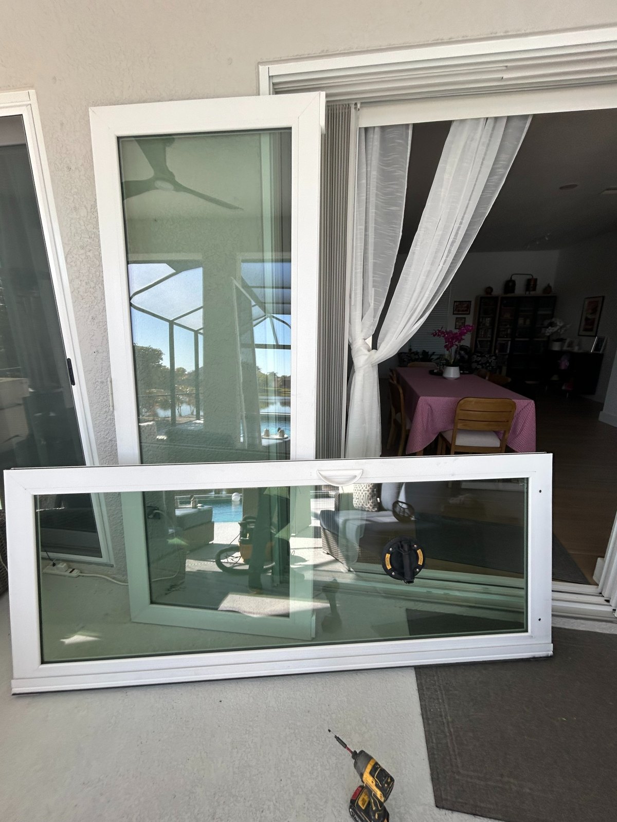 Sliding glass door panel removed during roller replacement service